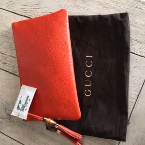 Gucci clutch with braided/tassel accent